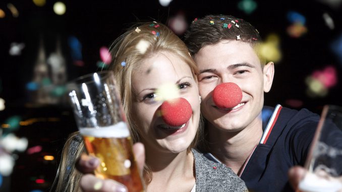 641-07433276 © Masterfile Royalty-Free Model Release: Yes Property Release: No Germany, North Rhine Westphalia, Cologne, young couple with clowns noses toasting