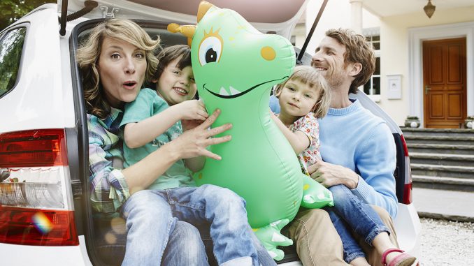 641-07847445 641-07847445 © Masterfile Royalty-Free Model Release: Yes Property Release: Yes Germany, Hesse, Frankfurt, Family sitting in boot of car, preparing for travel