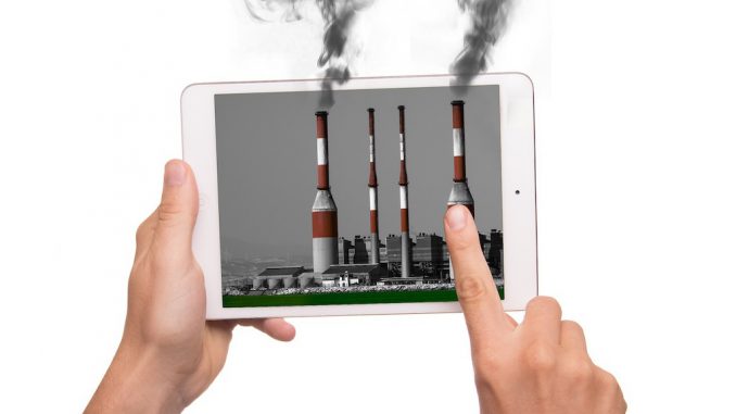 Tabletcomputer mit rauchenden Schloten.